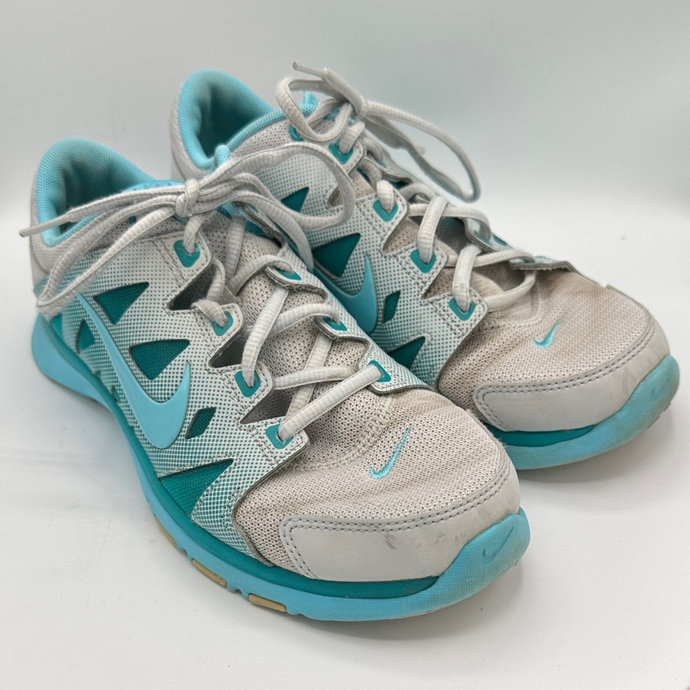 Nike turquoise and white athletic shoes, size 8